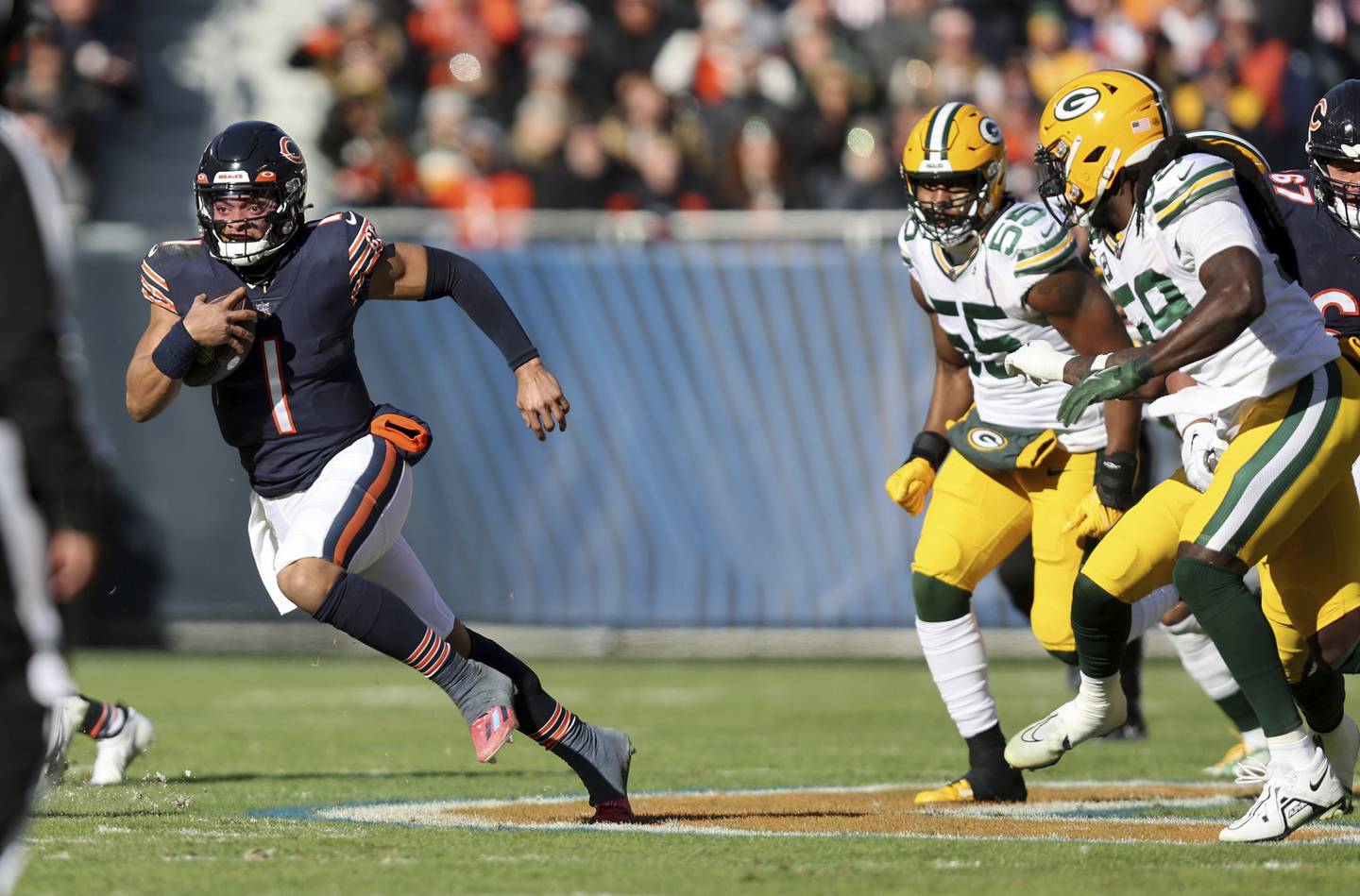 Bears quarterback Justin Fields breaks free for a long touchdown run in the first quarter against the Packers on Sunday, Dec. 4, 2022, at Soldier Field.