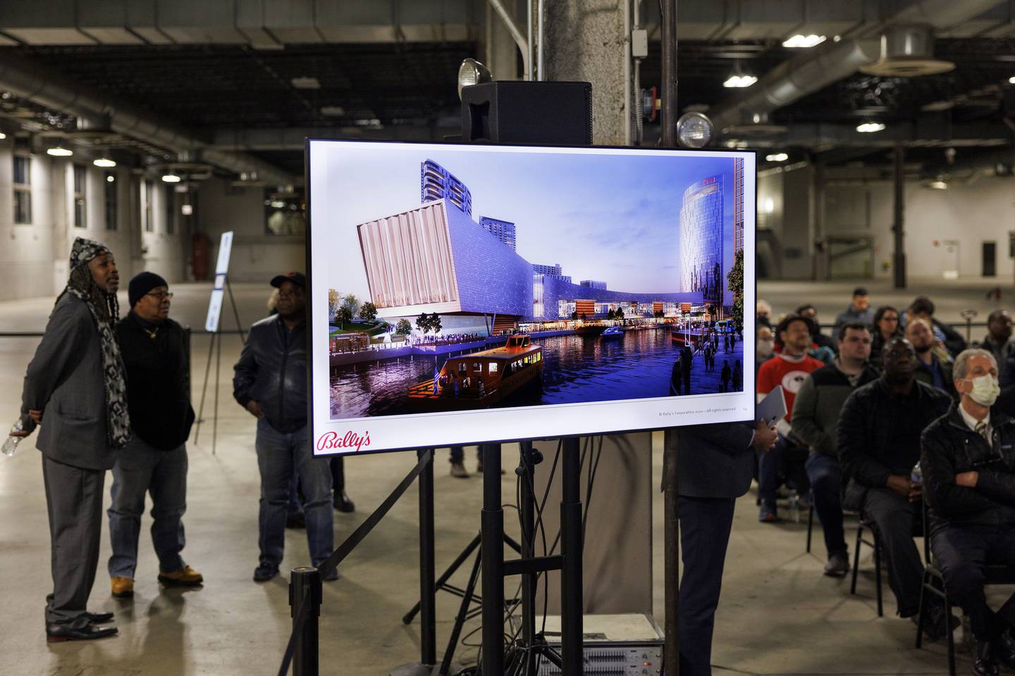 A rendering of the Bally's Casino on display as members of the public listen to a panel during a Chicago casino town hall at the Freedom Center Monday night.