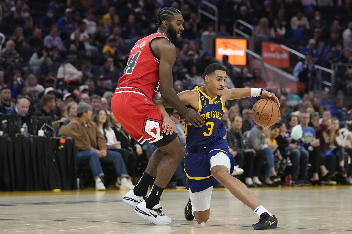 Warriors guard Jordan Poole (3) changes direction while defended by Bulls forward Patrick Williams during the first half Friday in San Francisco. 