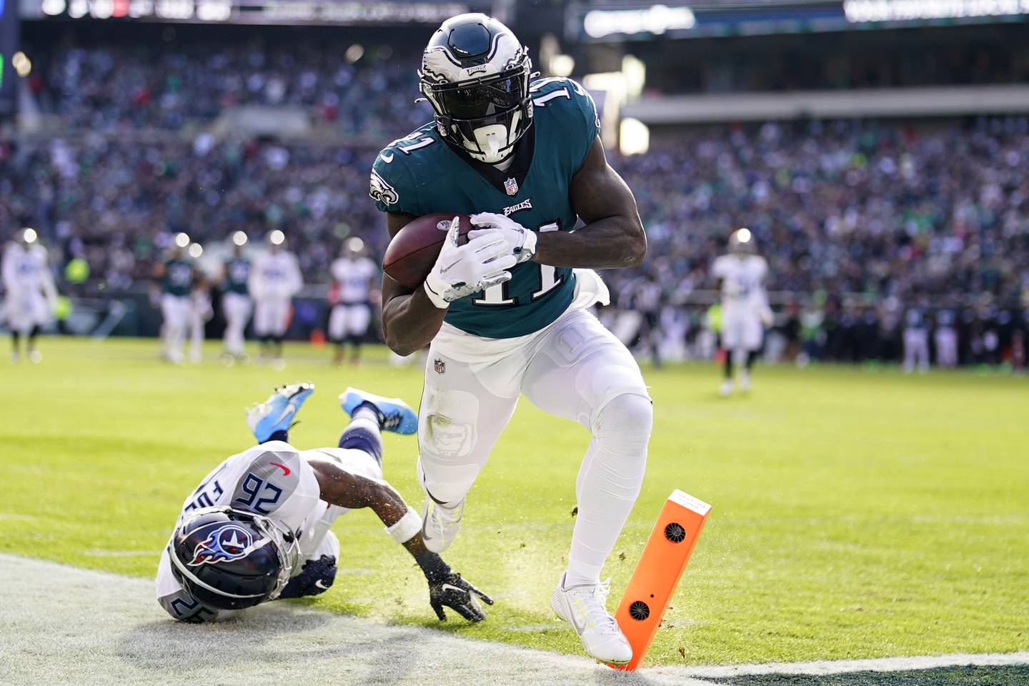 Eagles receiver A.J. Brown scores a touchdown in front of the Titans' Kristian Fulton on Dec. 4 in Philadelphia. 