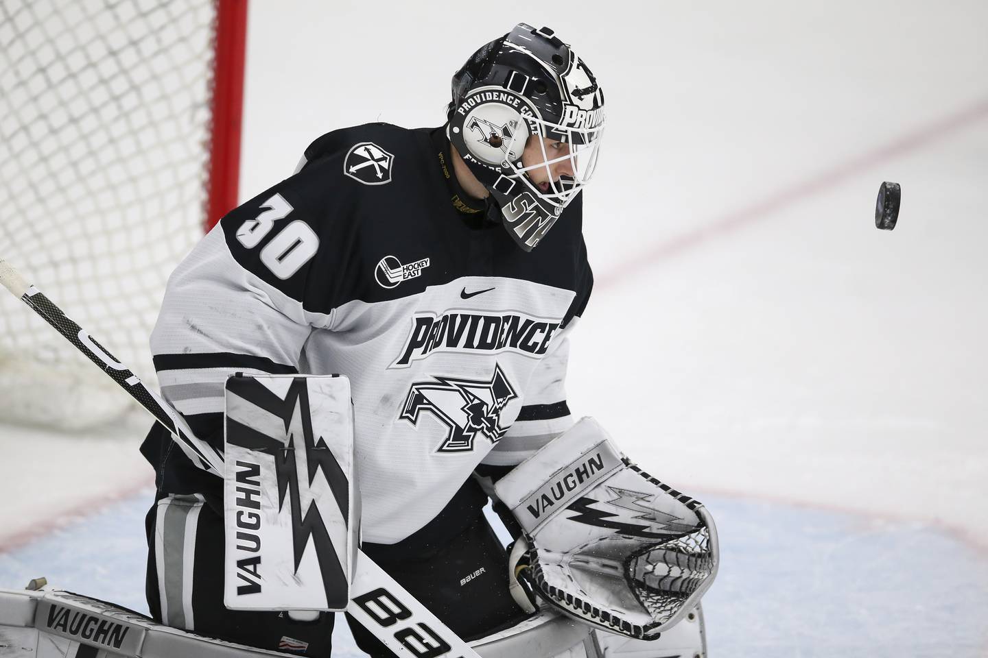 Providence's Jaxson Stauber makes a save during the first period of an NCAA game against New Hampshire on Oct. 29, 2021.