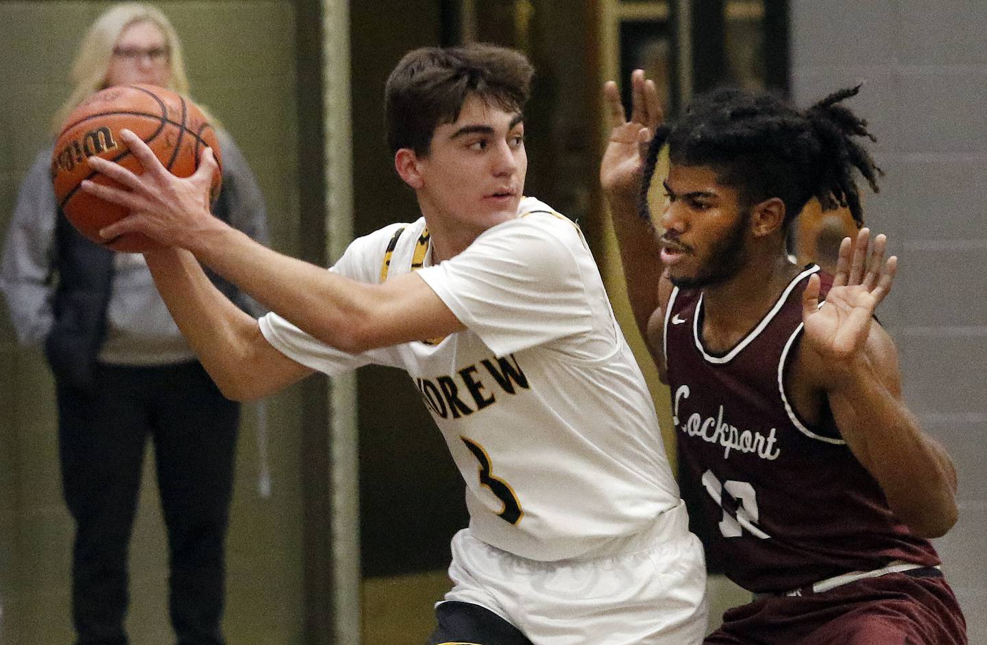 Lockport's Jalen Falcon, right, guards Andrew's Athan Berchos during a SouthWest Suburban Conference crossover on Friday, Dec. 9, 2022.