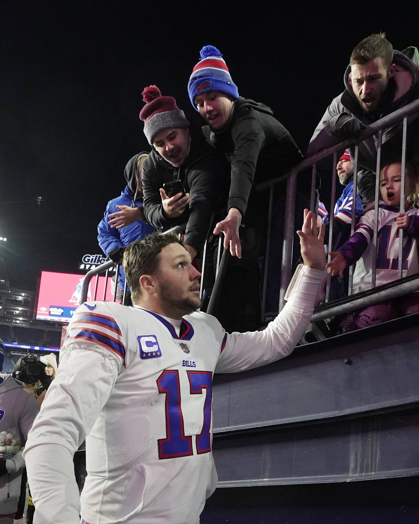 Bills quarterback Josh Allen (17) celebrates with fans after defeating the Patriots on Dec. 1, 2022, in Foxborough, Mass.