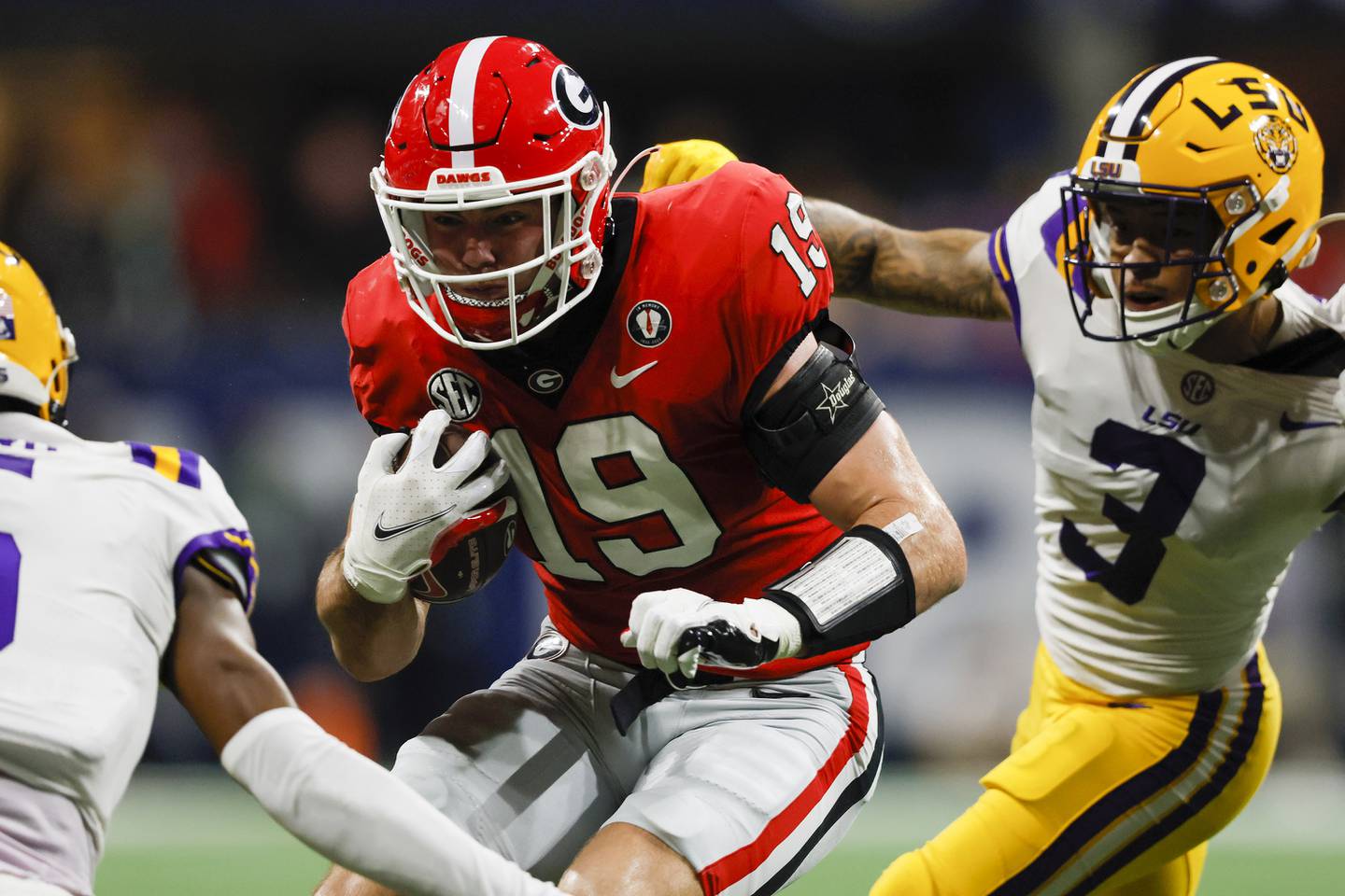 Georgia tight end Brock Bowers runs against LSU safety Greg Brooks Jr. during the second half of the SEC championship game on Dec. 3 at Mercedes-Benz Stadium in Atlanta.