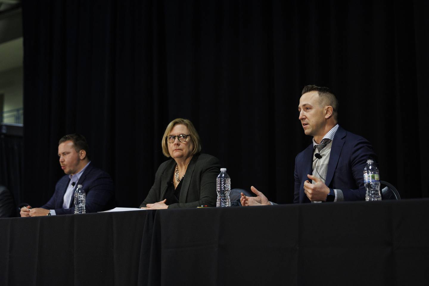 From left, Christopher Jewett, vice-president of corporate development at Bally’s, Christine Carlyle, principal and director of planning at Solomon Cordwell Buenz, and Brad McCauley, managing principal at Site Design Group, answer questions from the public, Dec. 5, 2022, during a Chicago casino town hall.  