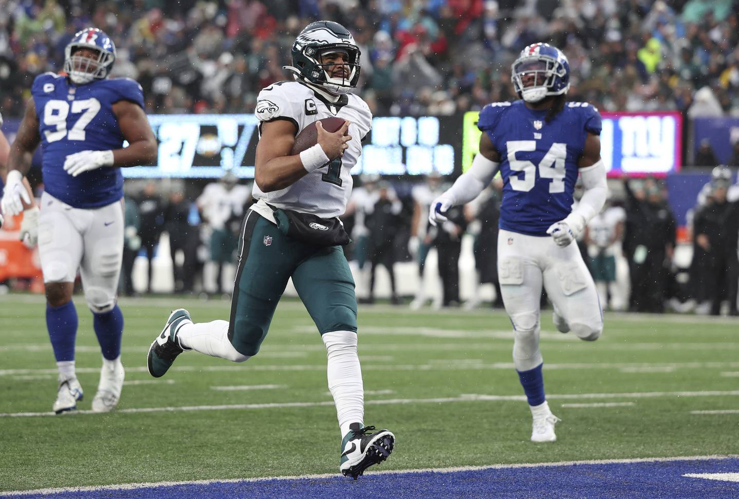 Eagles quarterback Jalen Hurts runs for a touchdown during the third quarter against the Giants on Sunday at MetLife Stadium in East Rutherford, N.J. 