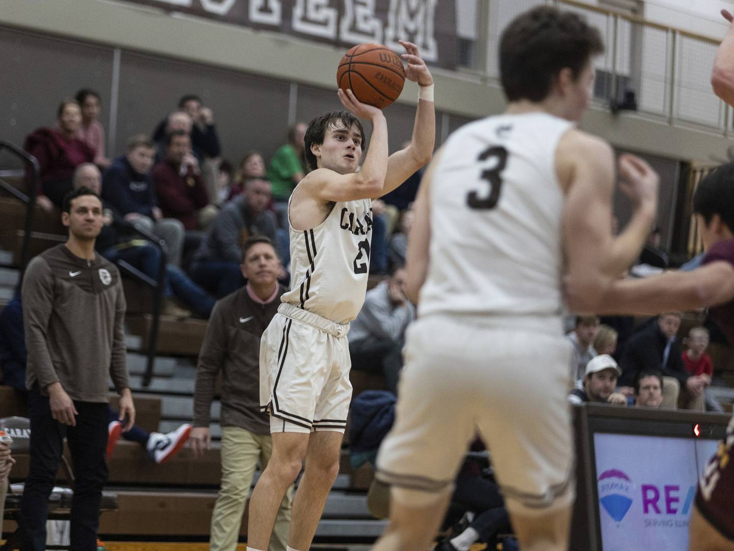 Mount Carmel's Anthony Ciaravino (21) drains a 3-pointer against Loyola during a Catholic League Blue game in Chicago on Tuesday, Dec. 20, 2022.