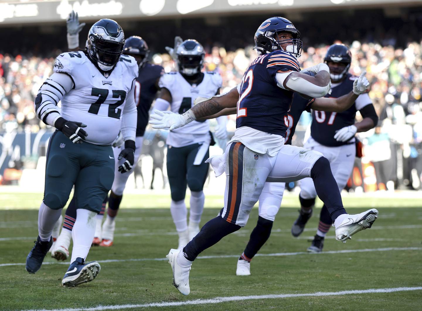 Bears running back David Montgomery runs in for a touchdown in the second quarter against the Eagles at Soldier Field on Dec. 18, 2022.