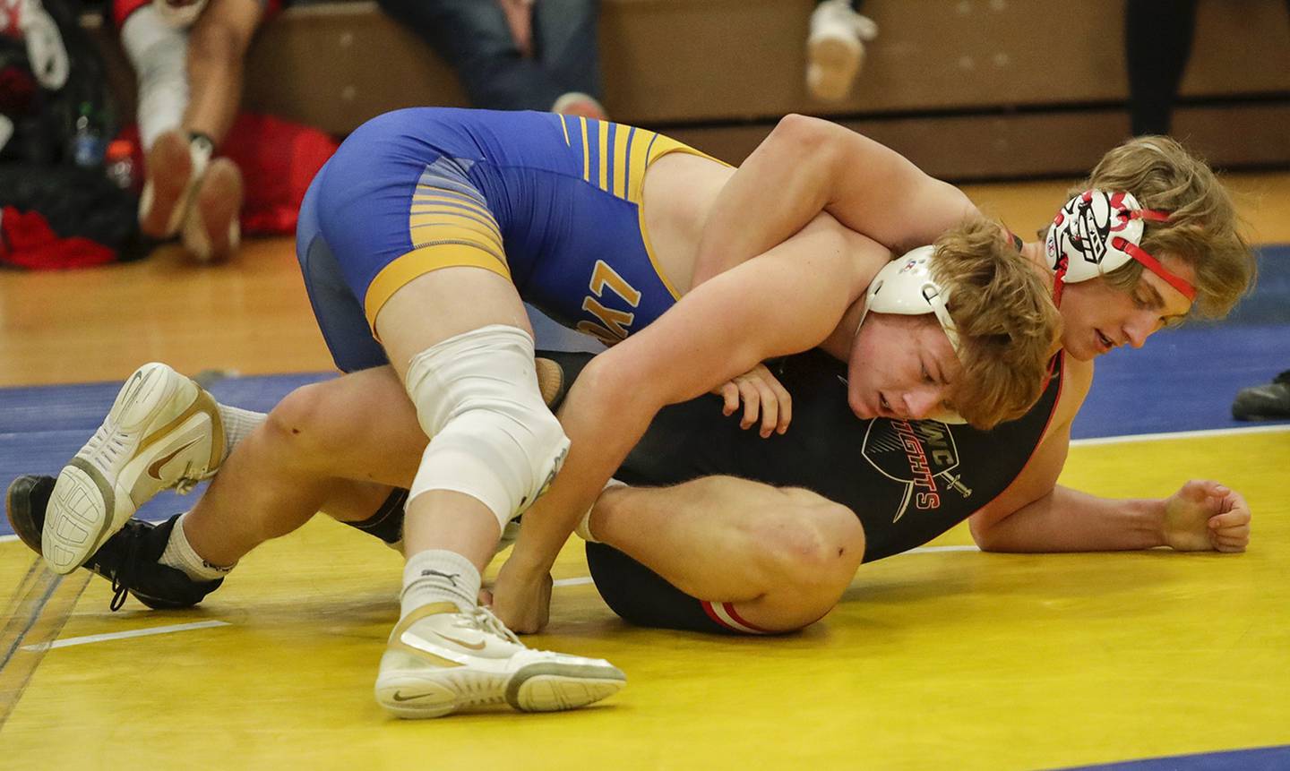 Lyons Township’s Cooper King, left, wrestles against Lincoln-Way Central’s Dominick Danno in a 195-pound match during the Lyons mega duals in La Grange on Saturday, Dec. 10, 2022.