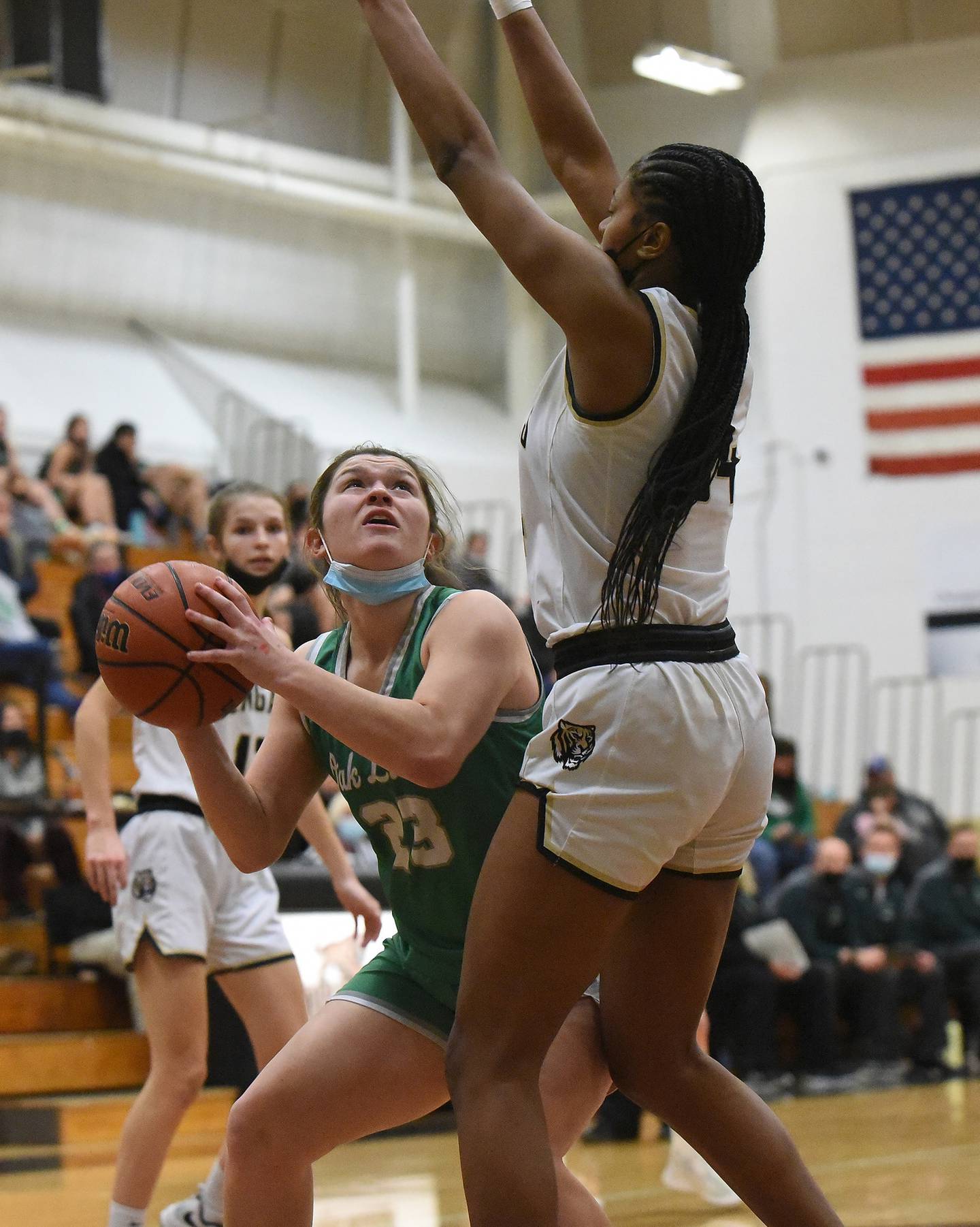 Oak Lawn's Mia Kennelly (23) tries to get off a shot against Oak Forest's Janae Kent (34) during a game on Monday, Feb. 7, 2022.