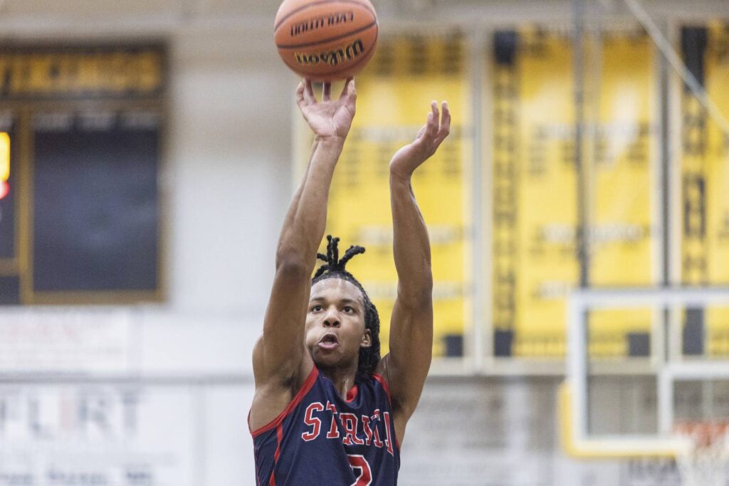 Sold on Holmes: With Michigan State’s Tom Izzo on hand, Nashawn Holmes gets going for St. Rita. ‘We all have one goal.’