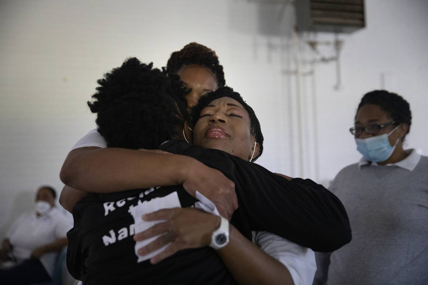 Sandra hugs Stephanie Bonds, center, and Mishunda Davis,right, as she visits the Logan Correctional Center, where she spent some of her 22-year sentence. Sandra visited the women at the facility, working with the Women’s Justice Institute, to show a film about domestic abuse, violence and incarceration. 