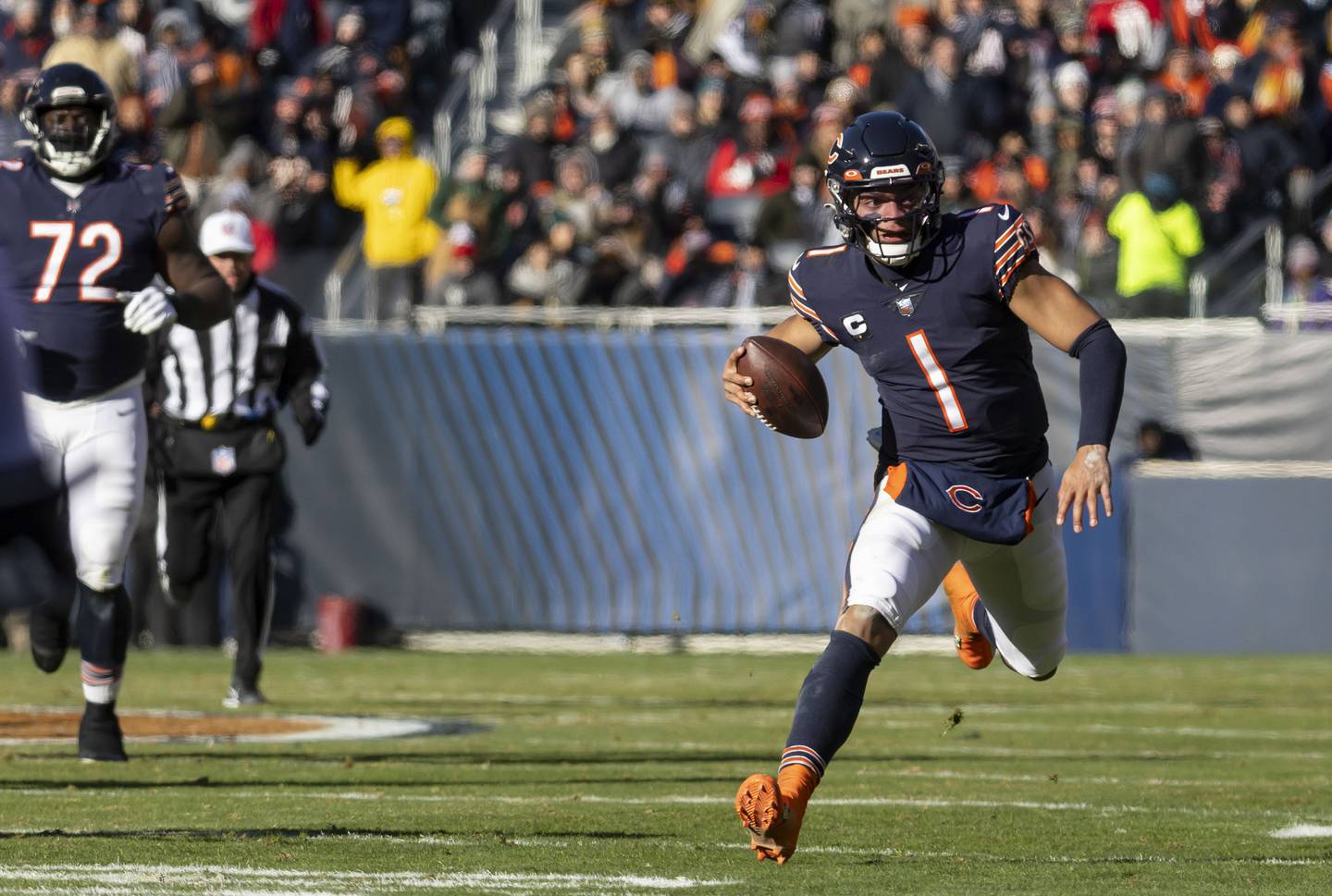 Bears quarterback Justin Fields rushes the ball in the second quarter on Dec. 18, 2022, at Soldier Field. 