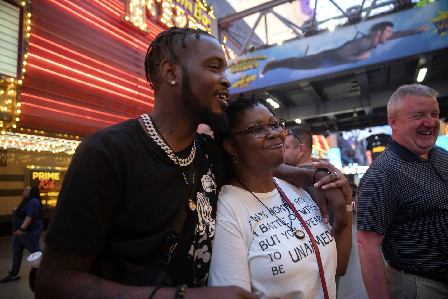 Sandra Brown walks on Fremont Street in Las Vegas with her son Gregory Dobbs on April 26, 2022. "I couldn't be prouder of him. What a beautiful family and beautiful home. I'm such a cream puff. I'm trying really hard to keep it together," she said of the visit. 