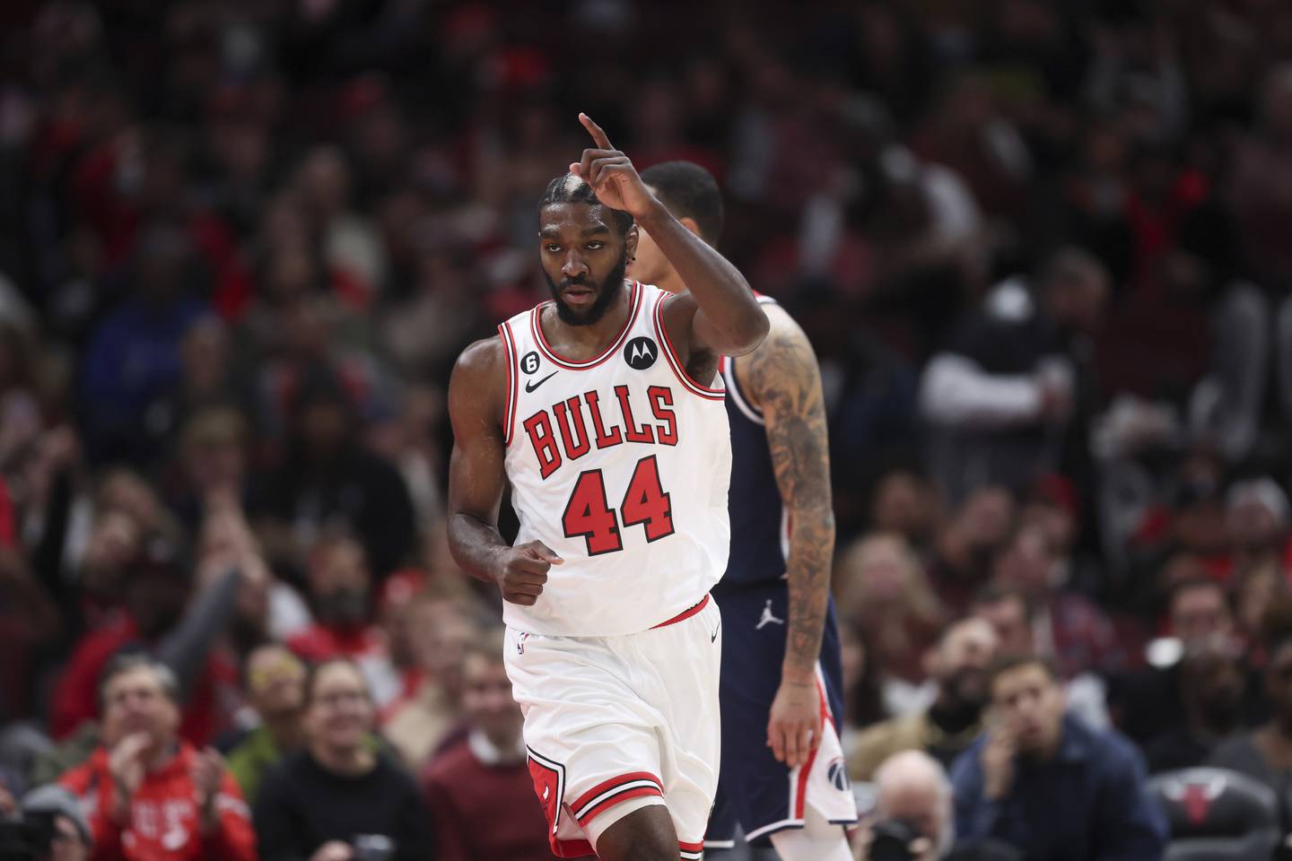 Bulls forward Patrick Williams points up after making a basket during the second period against the Wizards at the United Center on Dec. 7, 2022.