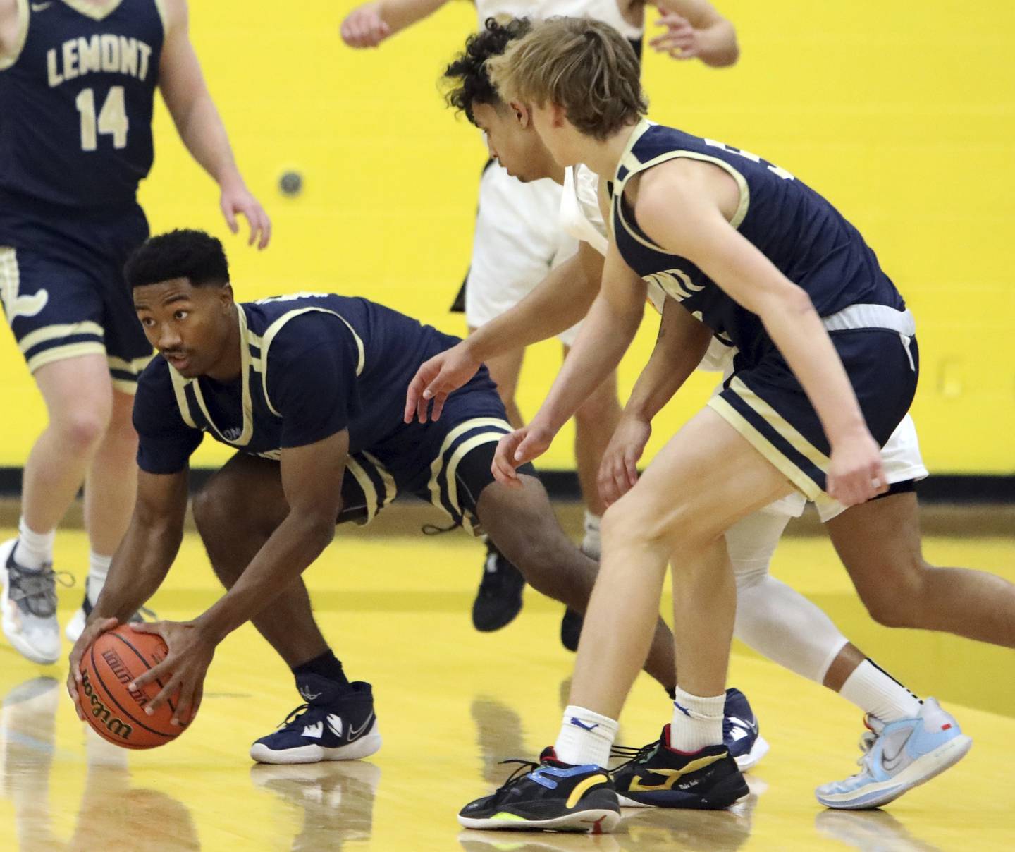 Lemont's Miles Beachum grabs a loose ball against Richards during a South Suburban Conference crossover in Oak Lawn on Tuesday, Dec. 6, 2022.