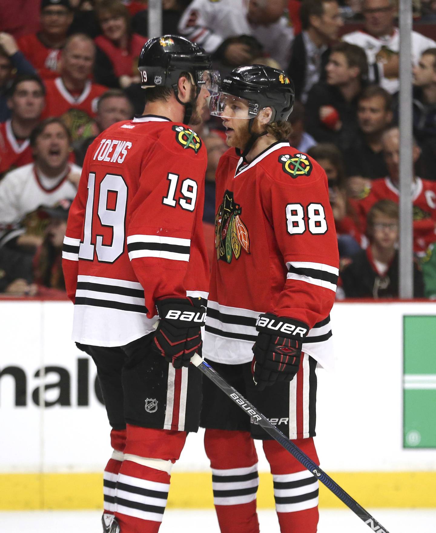 Blackhawks center Jonathan Toews (19) talks with right wing Patrick Kane during the final minutes of Game 3 of the Western Conference Finals against the Ducks on May 21, 2015, at the United Center. 
