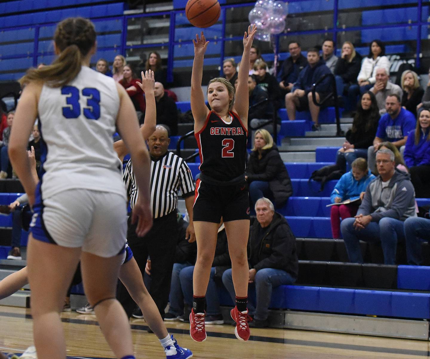 Lincoln-Way Central's Gracen Gehrke (2) puts up a 3-point shot against Lincoln-Way East during a SouthWest Suburban Conference crossover in Frankfort on Tuesday, Dec. 6, 2022.