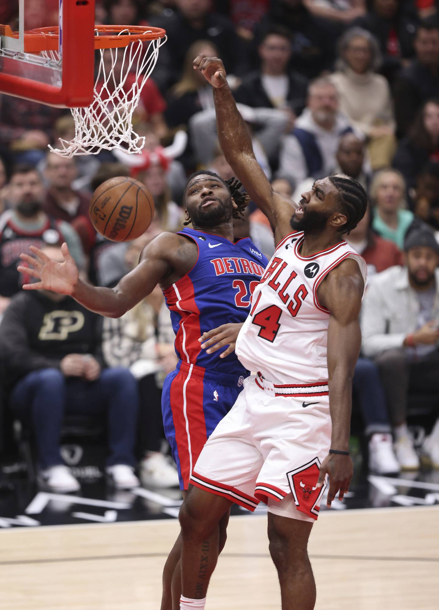 Bulls forward Patrick Williams (44) dunks over Pistons center Isaiah Stewart in the second quarter Friday at the United Center. 
