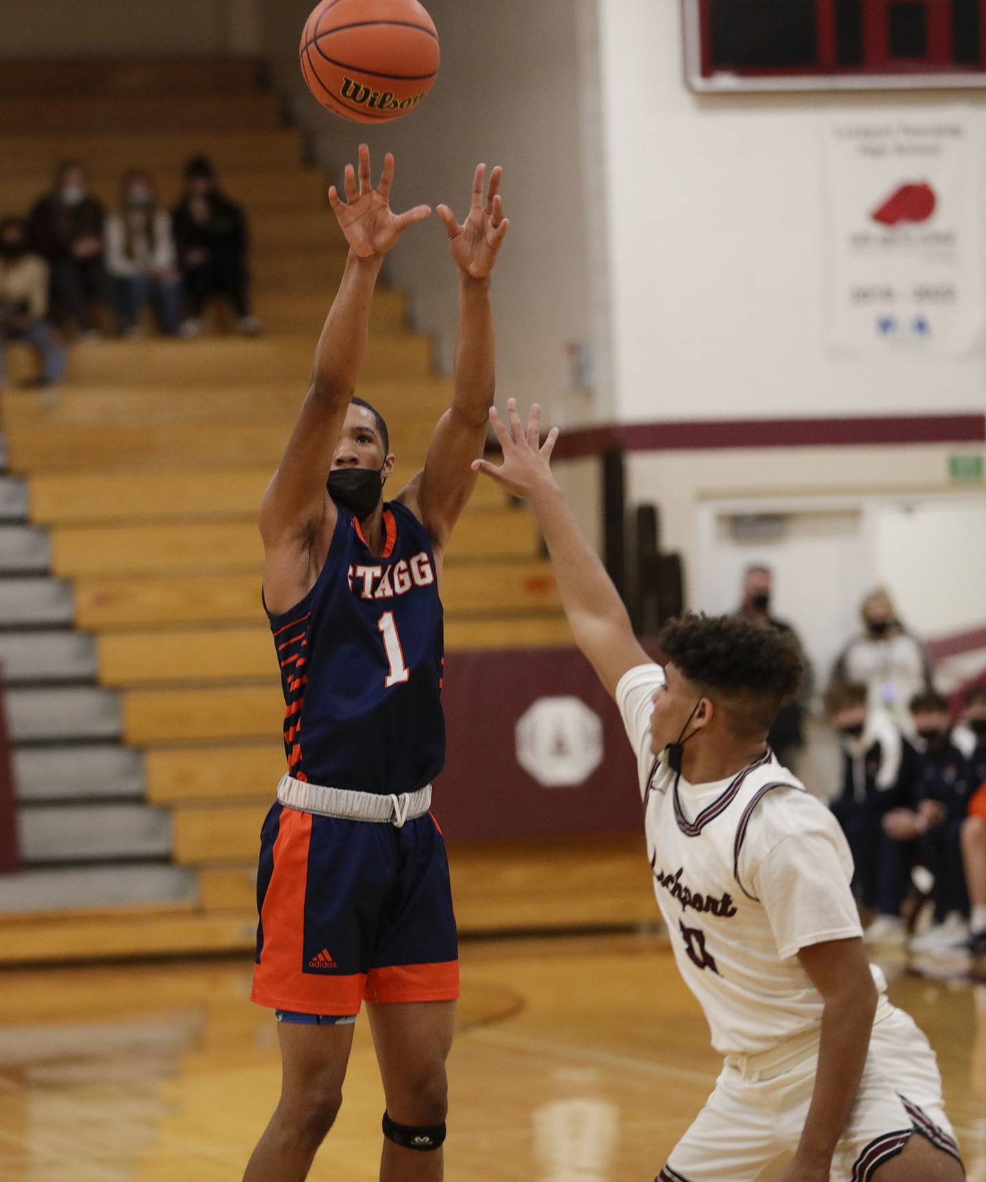 Stagg's Lebarion Gilmore (1) puts up a shot against Lockport's Anthony Munson (11) during a SouthWest Suburban Conference crossover in Lockport on Friday, Jan. 7, 2022.