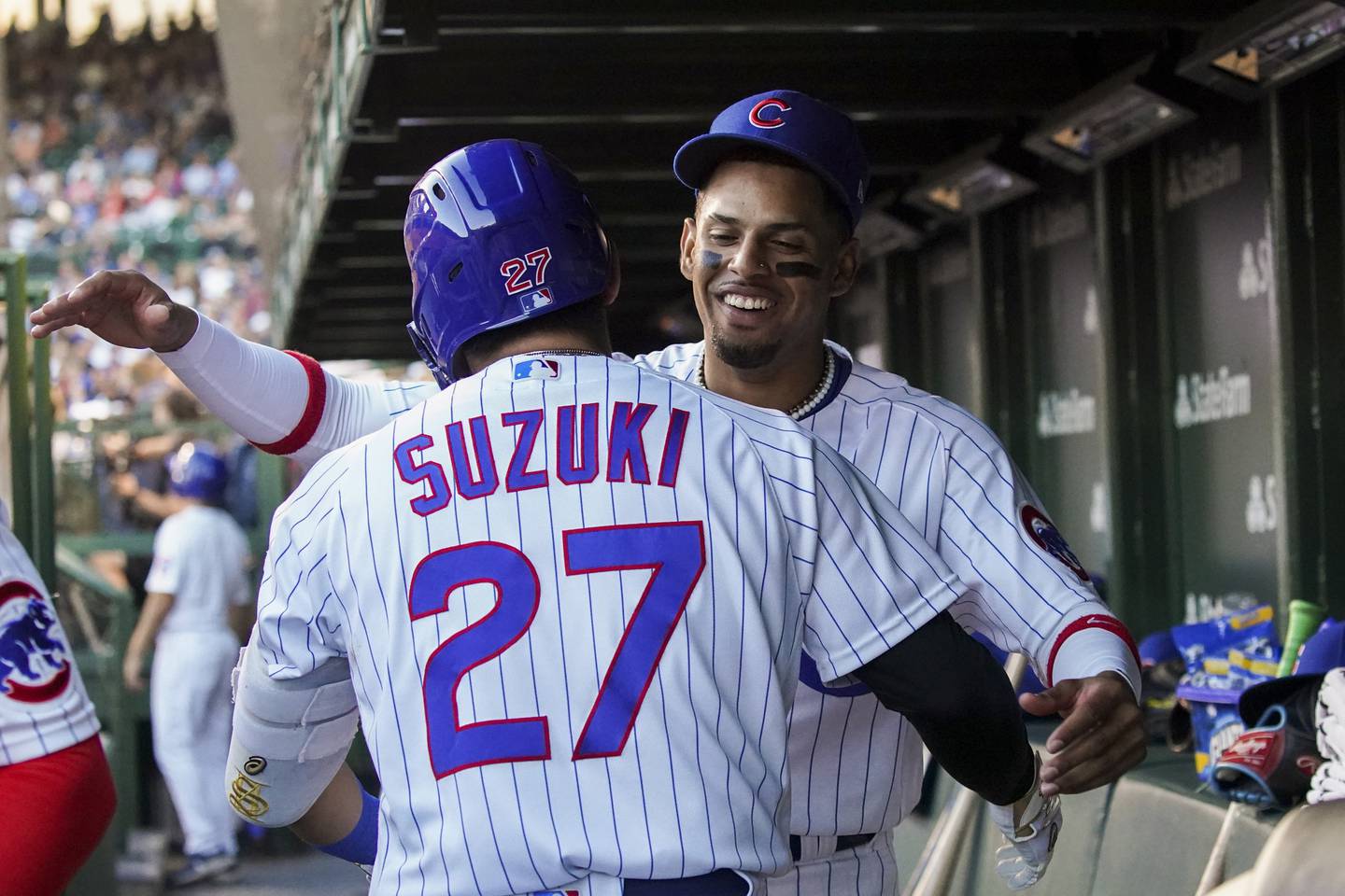 Cubs right fielder Seiya Suzuki hugs with second baseman Christopher Morel after hitting a solo-homer during the second inning against the Nationals on Aug. 9 at Wrigley Field.