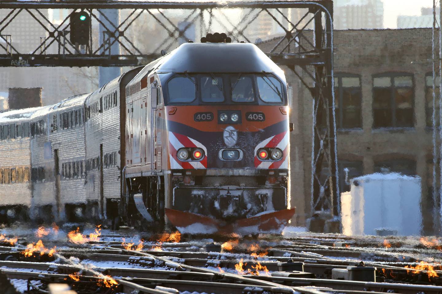 With temperatures in the single digits train crews ignite burners along the switches for tracks used by Amtrak trains near Western and Grand Avenues on the morning of Nov. 12, 2019.