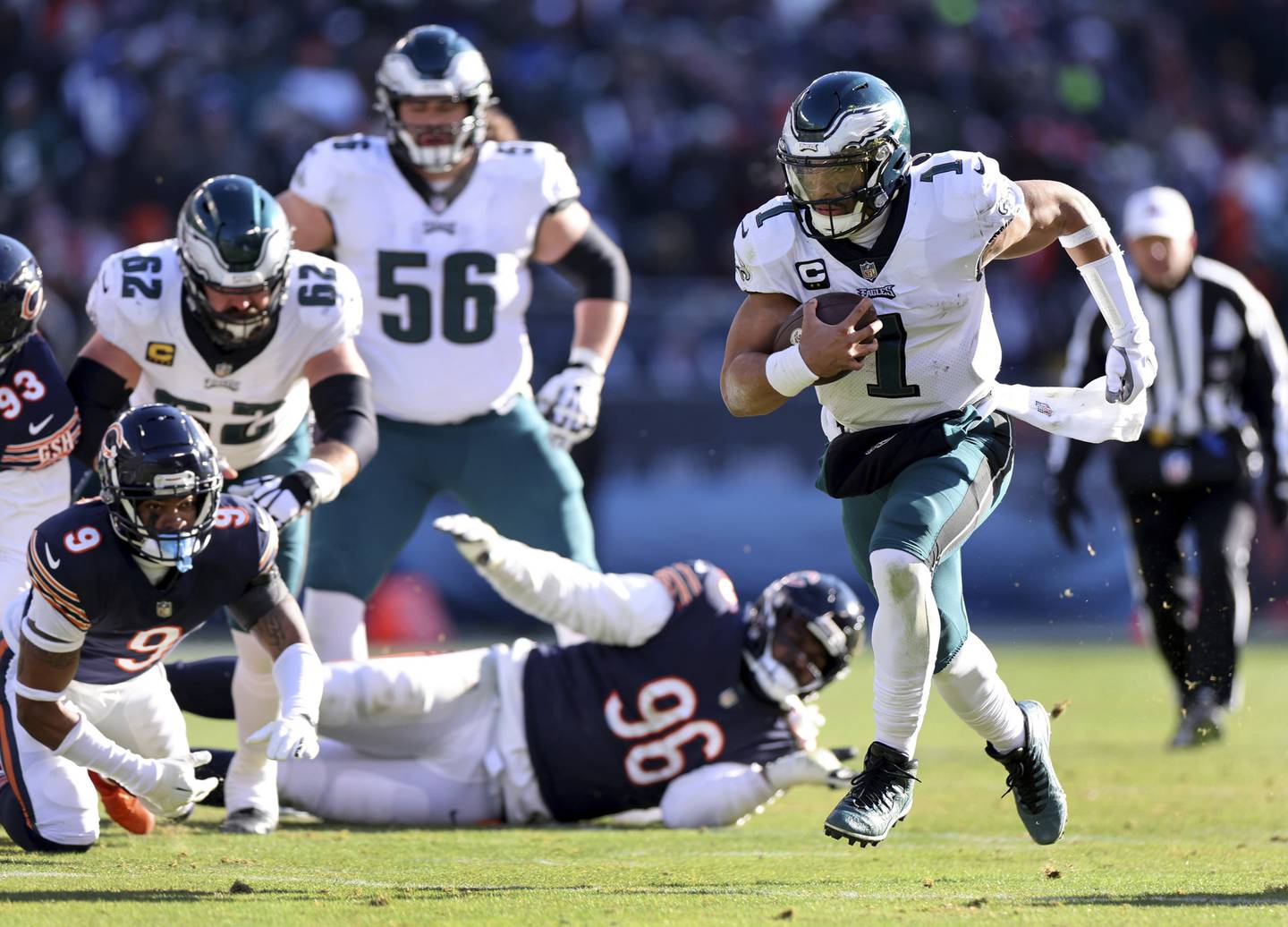Eagles quarterback Jalen Hurts (1) runs for a touchdown in the second quarter against the Bears on Sunday, Dec. 18, 2022, at Soldier Field.