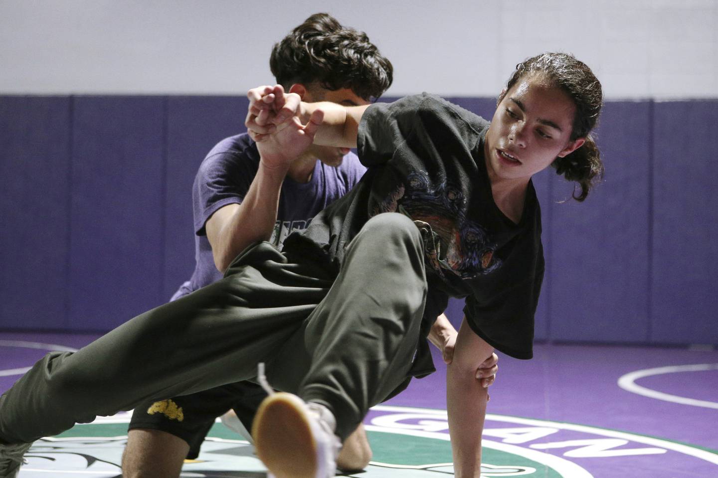 Waukegan’s Noelani Rodriguez, right, practices with Josua Montes at the school’s Brookside campus on Tuesday, Dec. 13, 2022. 