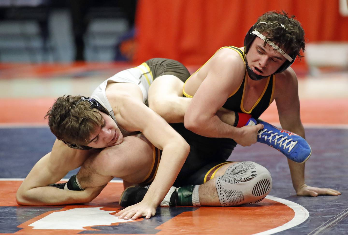 Joliet Catholic's Mason Alessio, left, and Montini's Jayden Colon battle in the 145-pound championship match in Class 2A at the State Farm Center in Champaign on Saturday, Feb. 19, 2022.