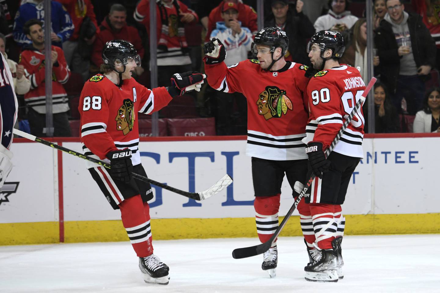 Max Domi (13) celebrates with Patrick Kane (88) and Tyler Johnson (90) after scoring against the Blue Jackets during the first period on Dec. 23, 2022.