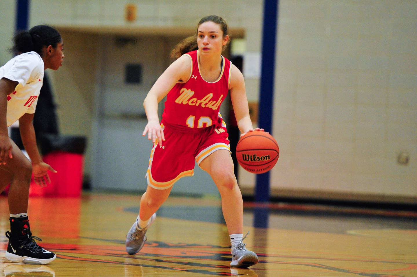 Mother McAuley's Jenna Badali looks for a play against Homewood-Flossmoor during a game on Monday, Feb. 24, 2020.
