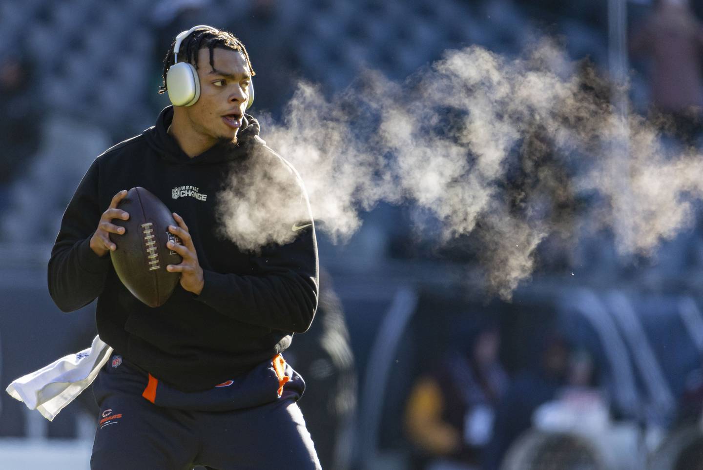 Bears quarterback Justin Fields warms up in the cold before a game against the Eagles on Dec. 18 at Soldier Field. 