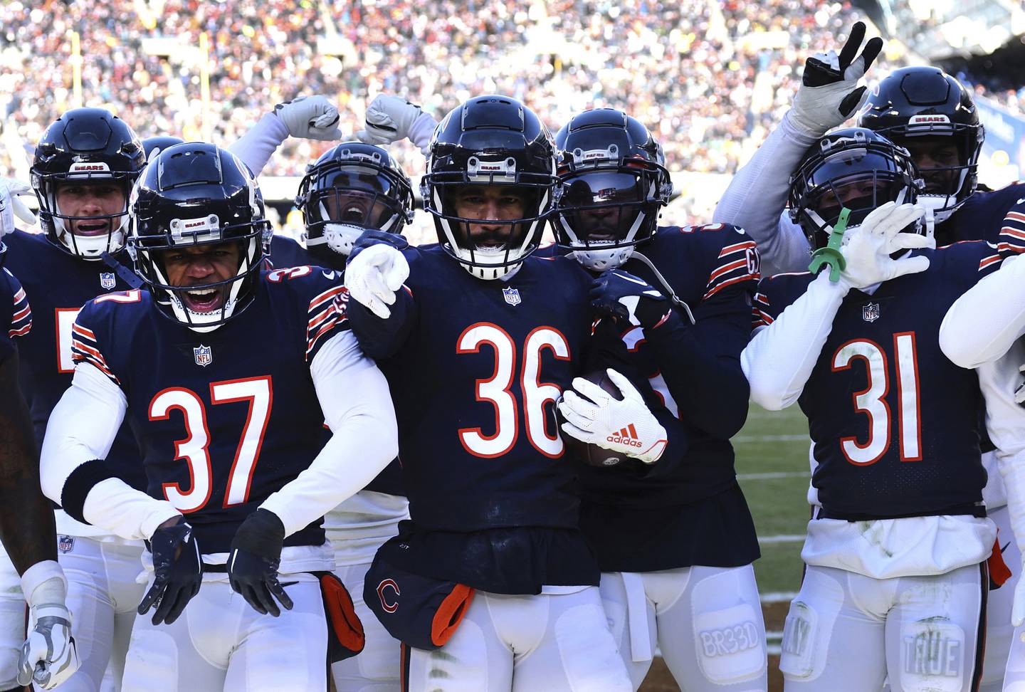 Bears safety DeAndre Houston-Carson celebrates with his teammates after his second-quarter interception against the Eagles at Soldier Field on Dec. 18, 2022.