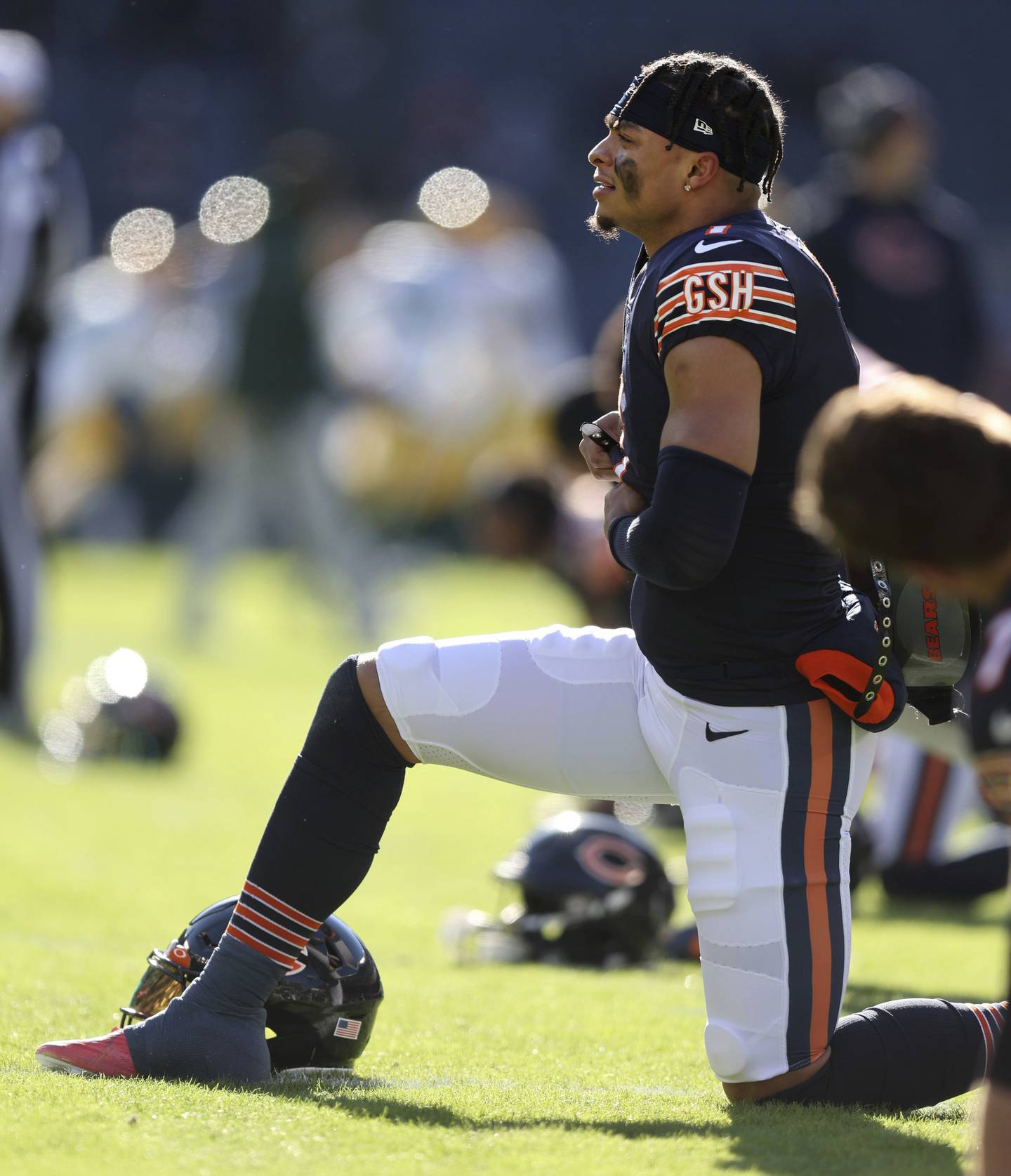 Bears quarterback Justin Fields stretches before a game against the Packers at Soldier Field on Dec. 4, 2022.
