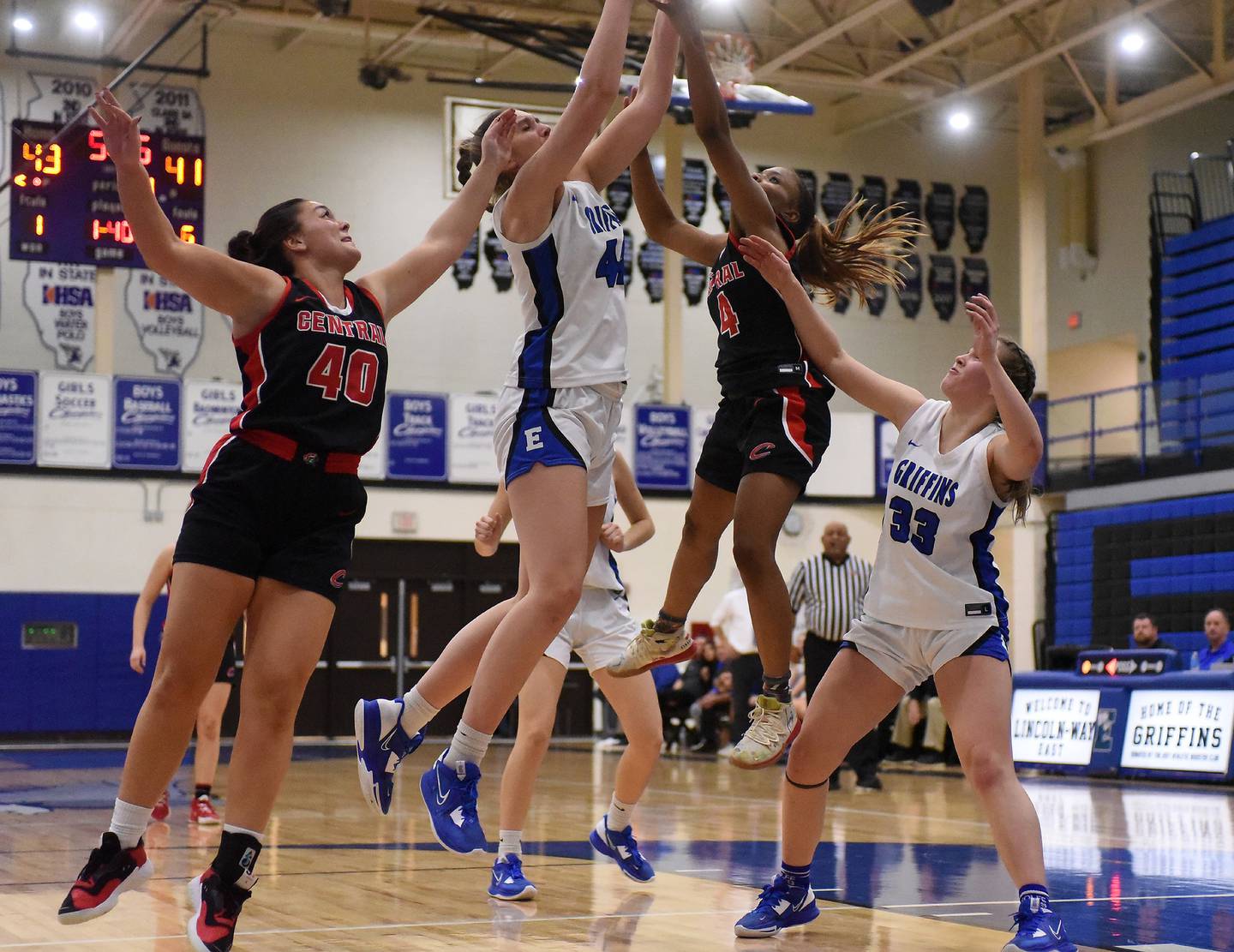 Lincoln-Way Central's Azyah Newson-Cole (4) tries to get a shot over Lincoln-Way East's Hayven Smith (44) during a SouthWest Suburban Conference crossover in Frankfort on Tuesday, Dec. 6, 2022.