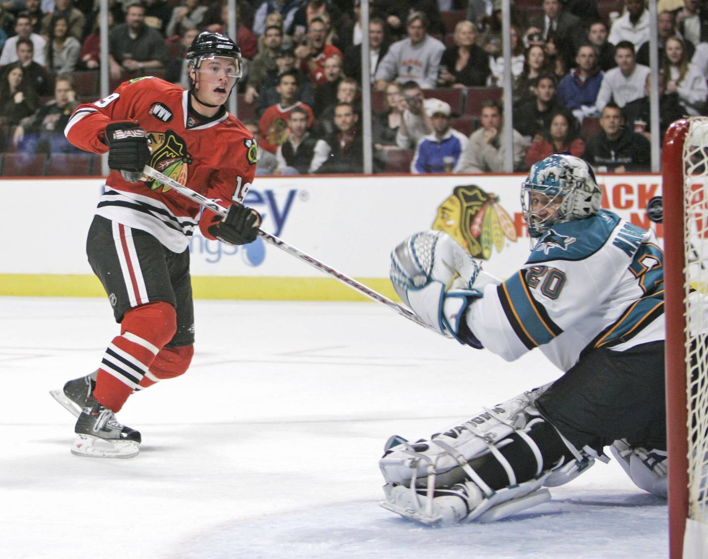 Jonathan Toews, in his first game with the Blackhawks, scores past Sharks goaltender Evgeni Nabokov in the first period on Oct. 10, 2007, at the United Center.