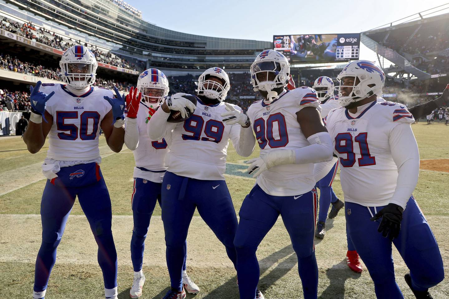 Bills' Tim Settle (99) celebrates a recovered fumble during the third quarter against the Bears at Soldier Field on Dec. 24, 2022.