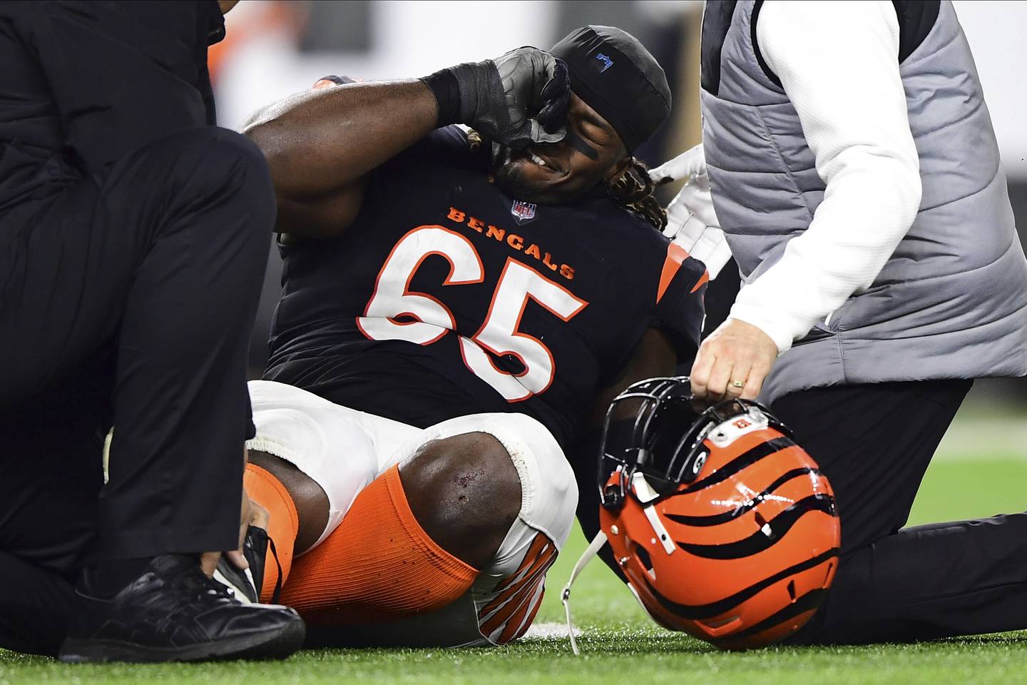 Bengals defensive tackle Larry Ogunjobi reacts after an injury during a wild-card playoff game against the Raiders on Jan. 15, 2022.
