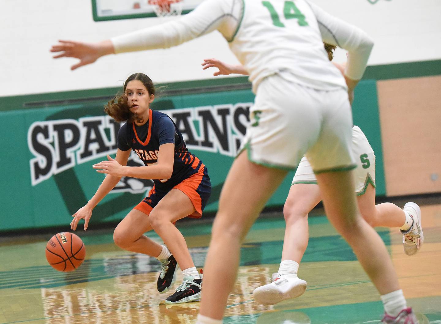 Stagg's Ameli Sanchez (5) works the ball up the court against Oak Lawn during a nonconference game in Oak Lawn on Tuesday, Dec. 20, 2022.
