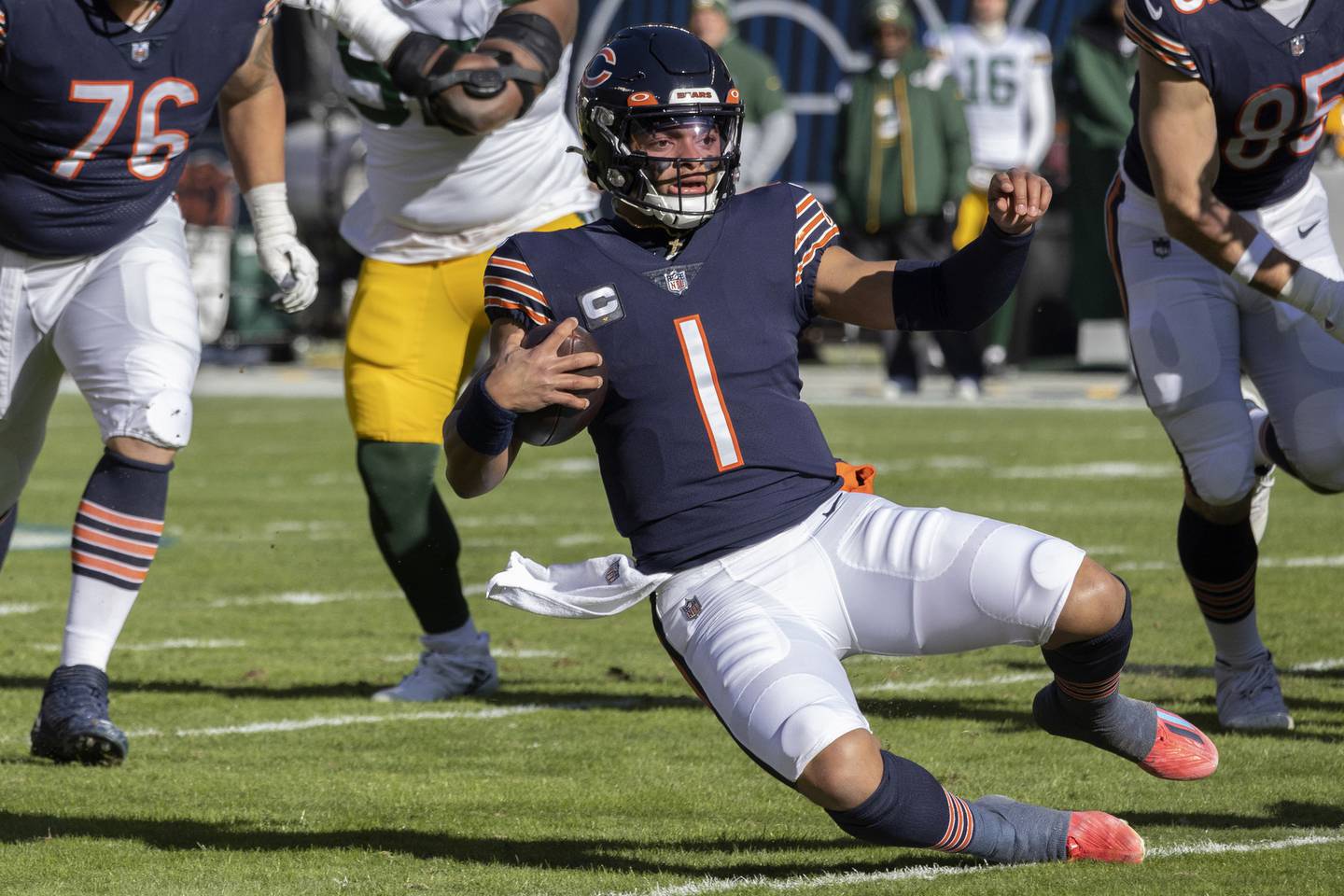 Bears quarterback Justin Fields runs the ball during the first quarter against the Packers on Dec. 4 at Soldier Field. Fields needs 95 rushing yards to become the third quarterback in NFL history to rush for 1,000 yards in a season. 