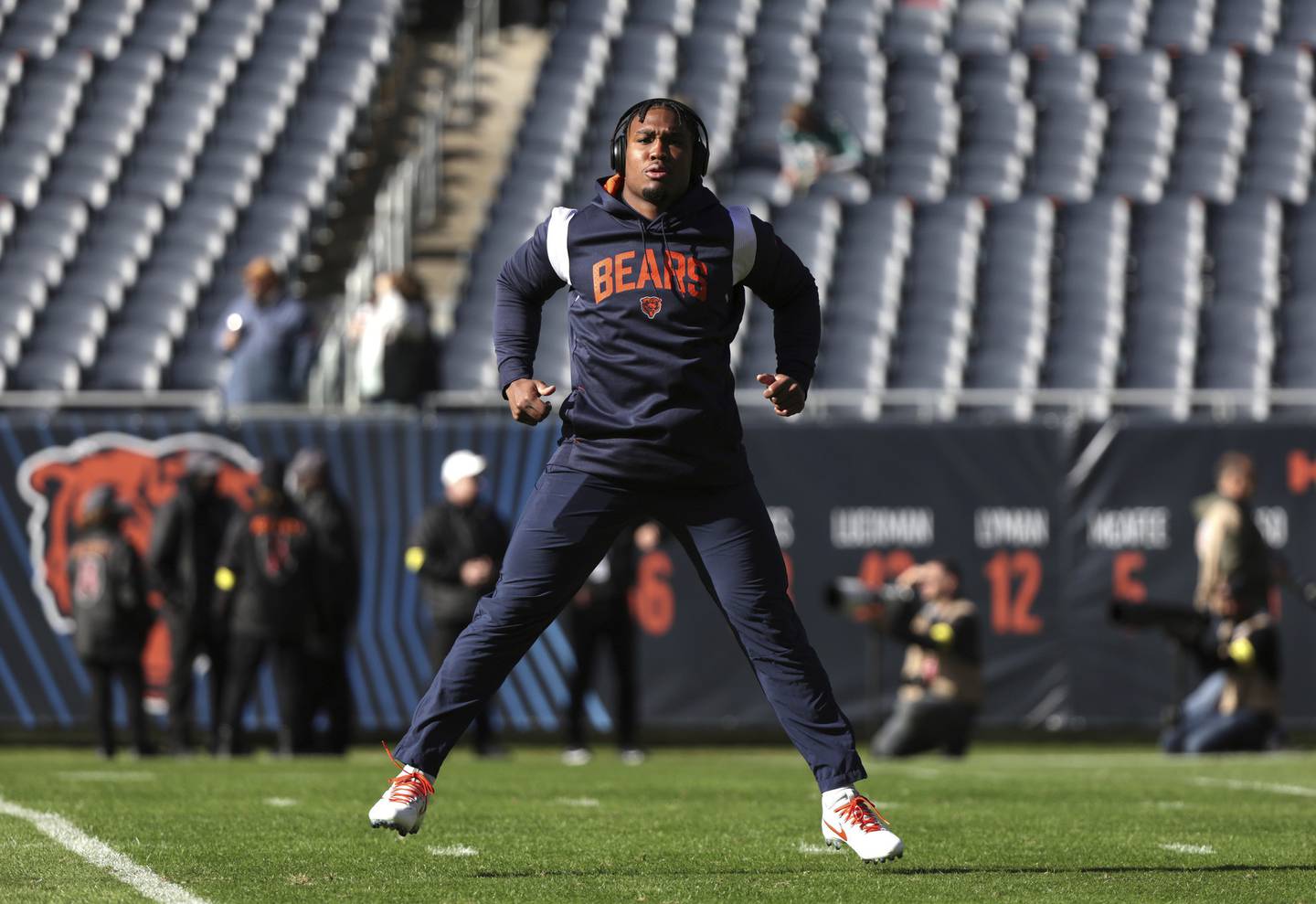 Bears running back Khalil Herbert warms up before a game against the Dolphins at Soldier Field on Nov. 6, 2022.