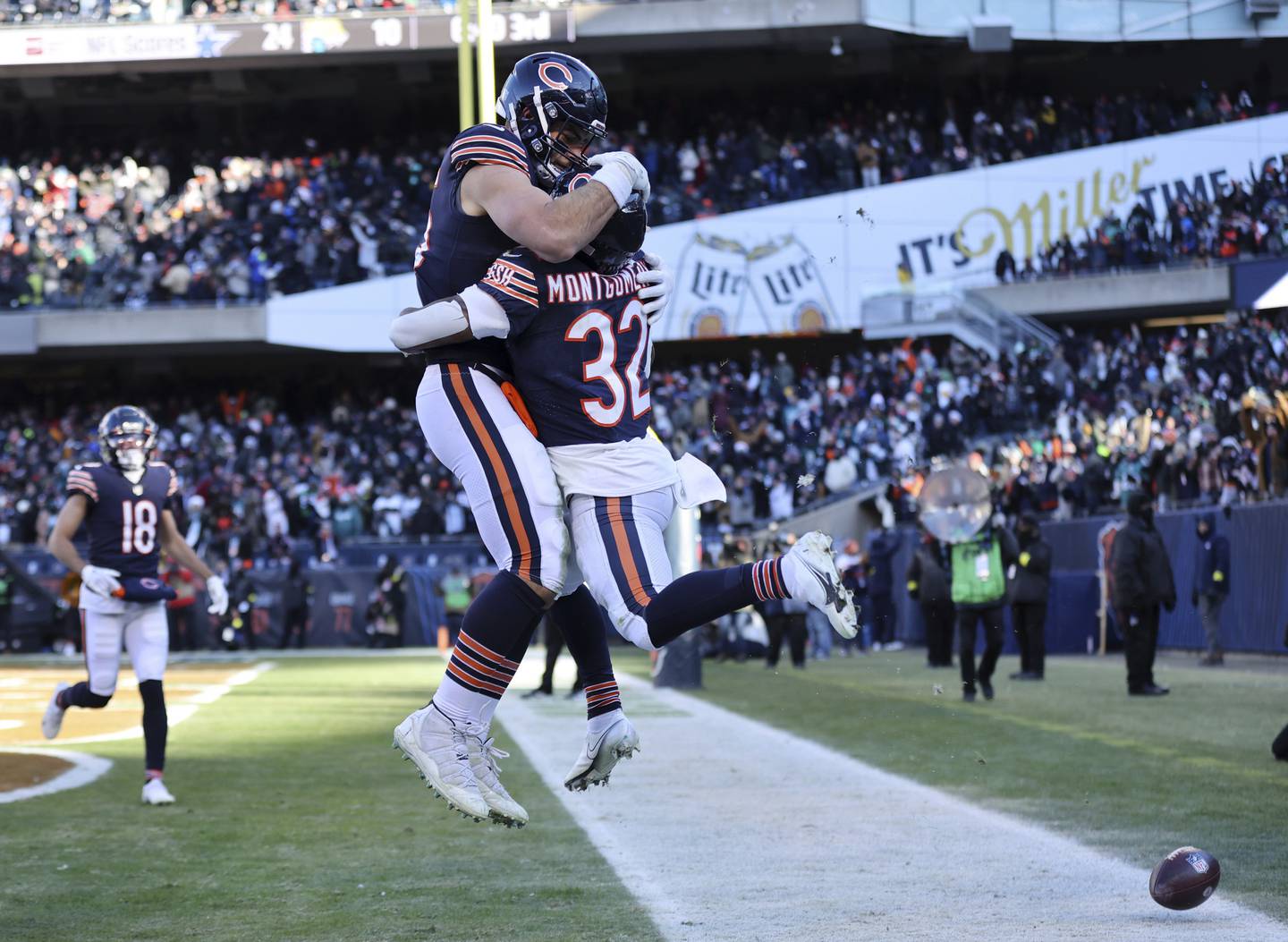 Bears running back David Montgomery (32) is congratulated by tight end Cole Kmet (85) after Montgomery caught a touchdown pass in the third quarter Sunday, Dec. 18, 2022, at Soldier Field.
