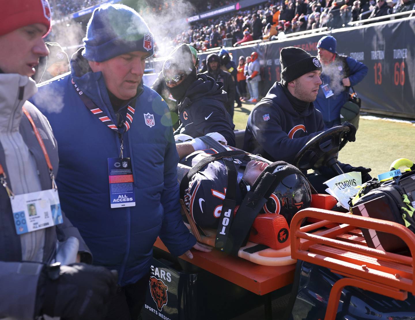 Bears offensive tackle Teven Jenkins is carted off the field after suffering an injury in the first quarter against the Eagles at Soldier Field on Dec. 18, 2022.