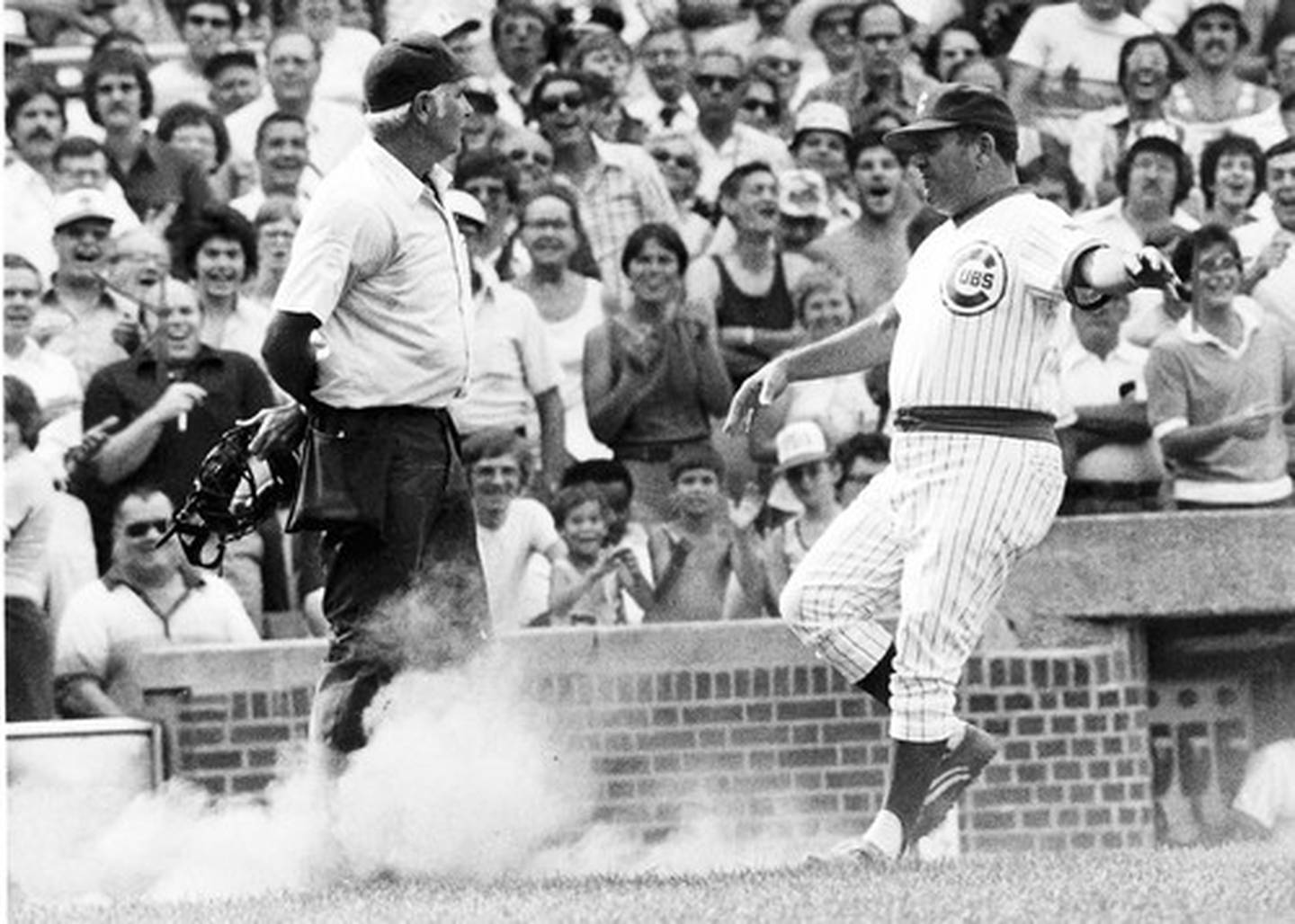 Cubs manager Herman Franks kicks dirt on umpire Doug Harvey during a game at Wrigley Field on Sept. 7, 1978.
