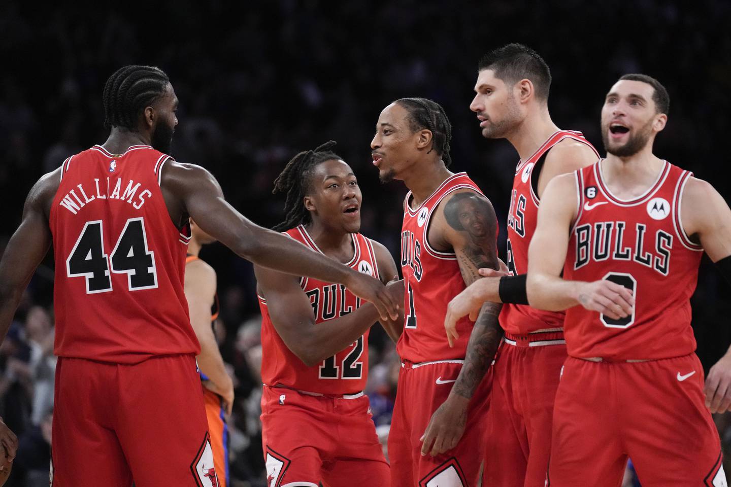 Bulls forward DeMar DeRozan, center, celebrates with teammates after hitting the winning basket during the closing seconds against the Knicks on Friday at Madison Square Garden in New York. The Bulls won 118-117. 