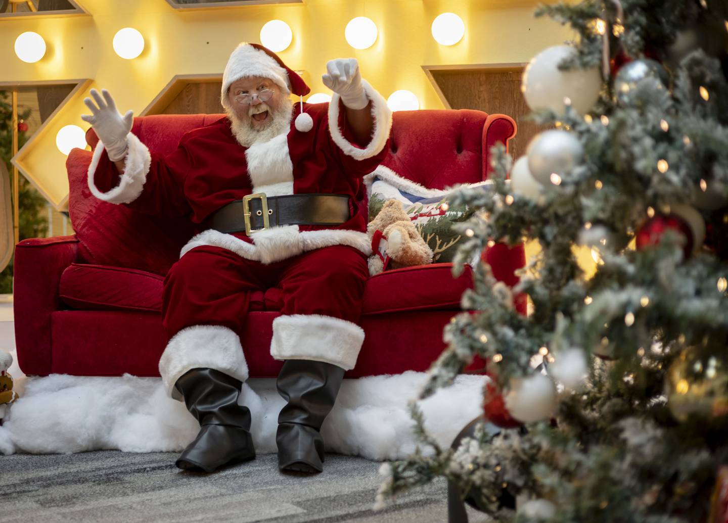 Jacob Nash as Santa Claus waves to visitors on Dec. 13, 2022, at Chicago Ridge Mall. As a trans Santa, Nash believes inclusion is inherent in the message of Santa itself. His “unapologetic” representation of the LGBTQ community has resonated with many.