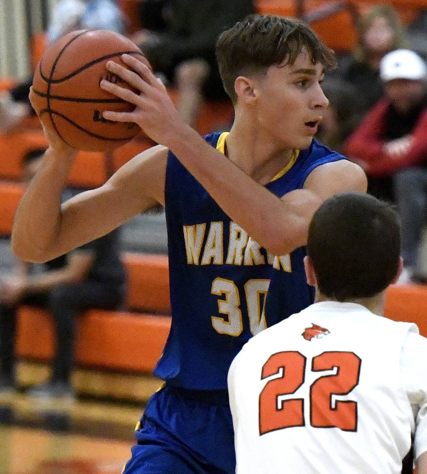 Warren’s Jack Wolf (30) looks to pass as Libertyville’s Jack Huber defends during a game in Libertyville on Tuesday, Dec. 6, 2022.