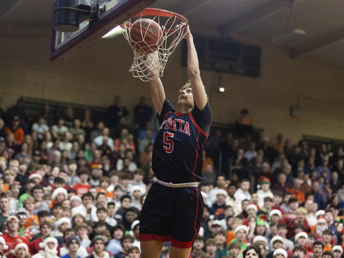 St. Rita's Nojus Indrusaitis (5) dunks against Brother Rice during a Catholic League Blue game in Chicago on Thursday, Dec. 9, 2022.