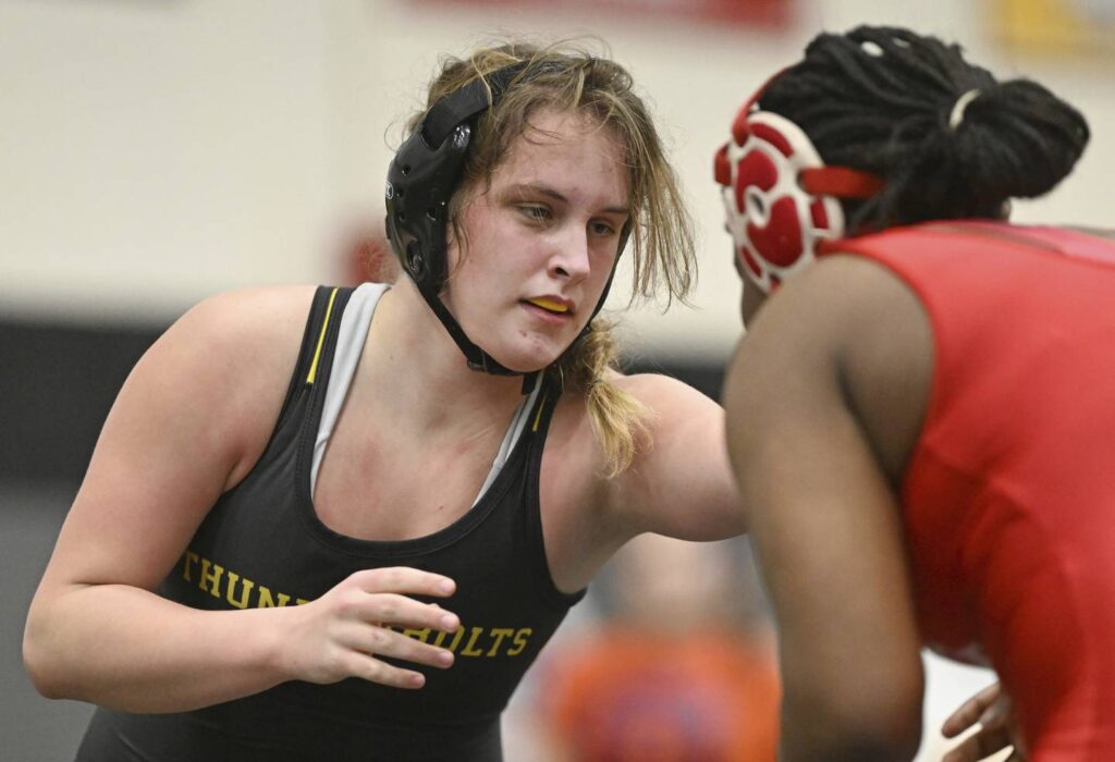 Peachy Keane: Sisters Alyssa and Mickaela Keane keep eyes on the prize for Andrew girls wrestling. ‘We’re kind of besties now.’