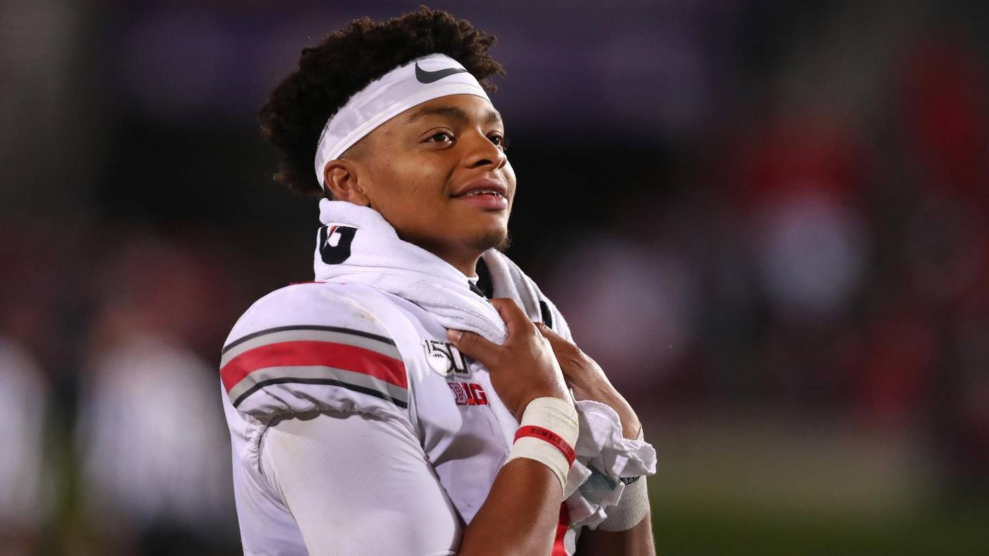 Ohio State quarterback Justin Fields looks on from the bench in the third quarter of a game against Northwestern at Ryan Field on Oct. 18, 2019.